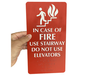 Fire exit sign with braille