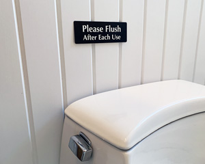 Please flush after each use sign
