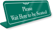 Wait Here To Be Seated Showcase Desk Sign