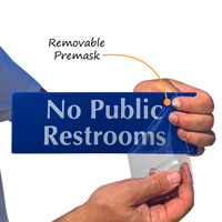 No public restrooms sign with protective premask
