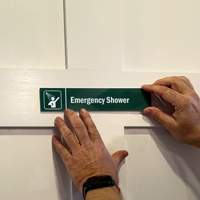 Emergency Shower Sign on a Door