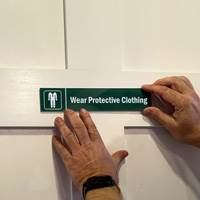 Wear Protective Clothing Sign on a Door