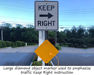 Large yellow reflector, diamond shaped sign