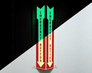 Photoluminescent emergency sign