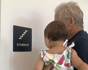 Stairway door braille sign