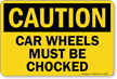 Car Wheels Must be Chocked Sign