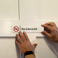 This Is Not An Exit Sign on a Door