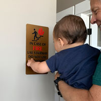 Fire exit sign with braille