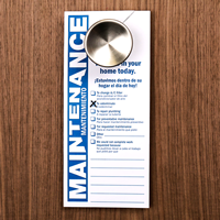 Bilingual Maintenance Personnel Working Door Hanger